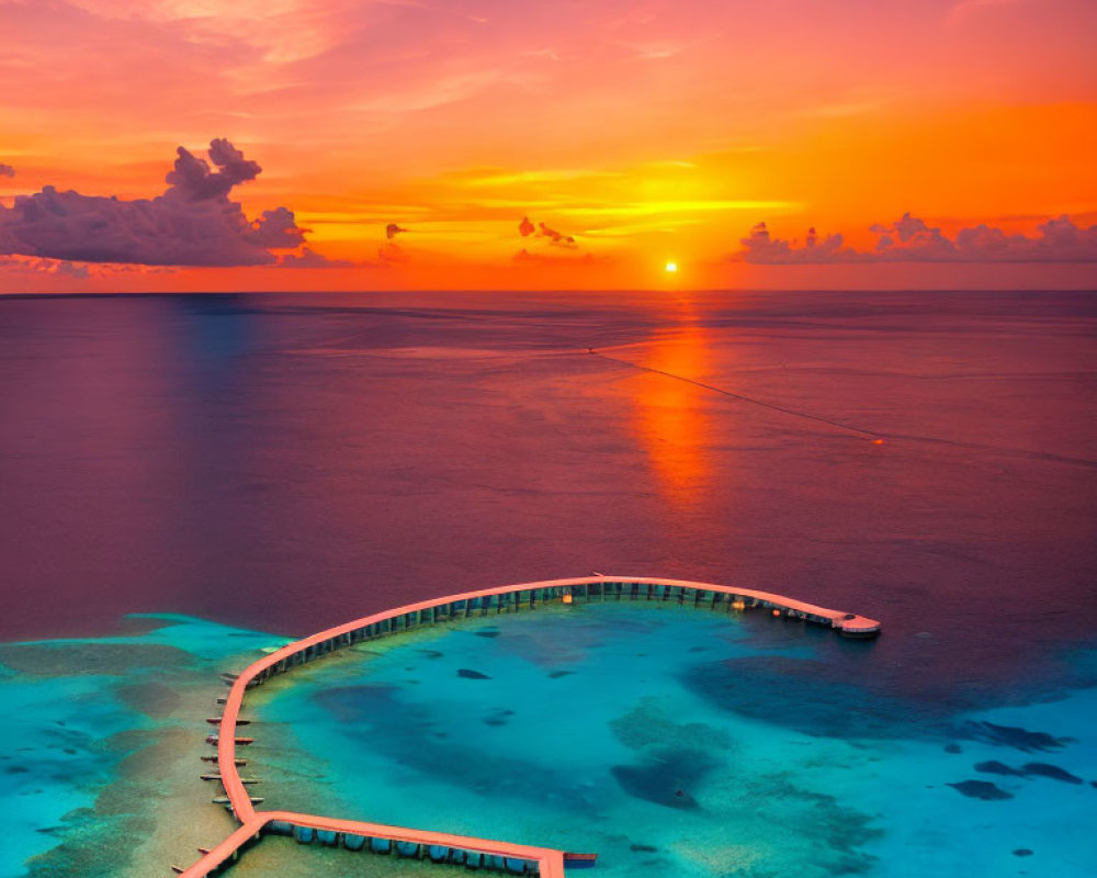 Tranquil sunset over sea with pier and boat silhouette