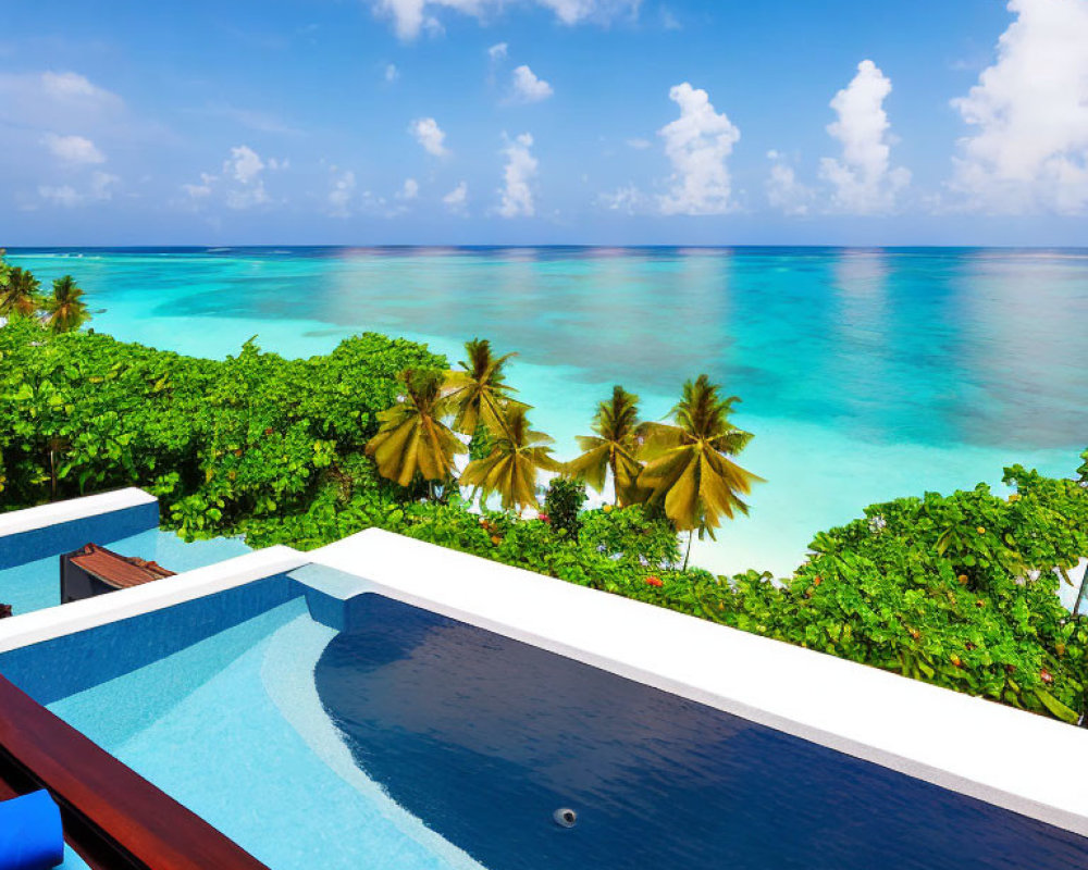 Infinity pool blending with tropical beach and clear blue sea under bright sky with palm trees.