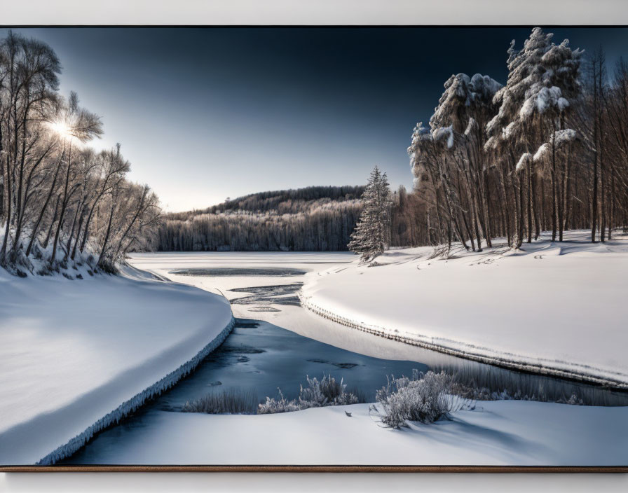 Snow-covered trees and frozen river in serene winter landscape