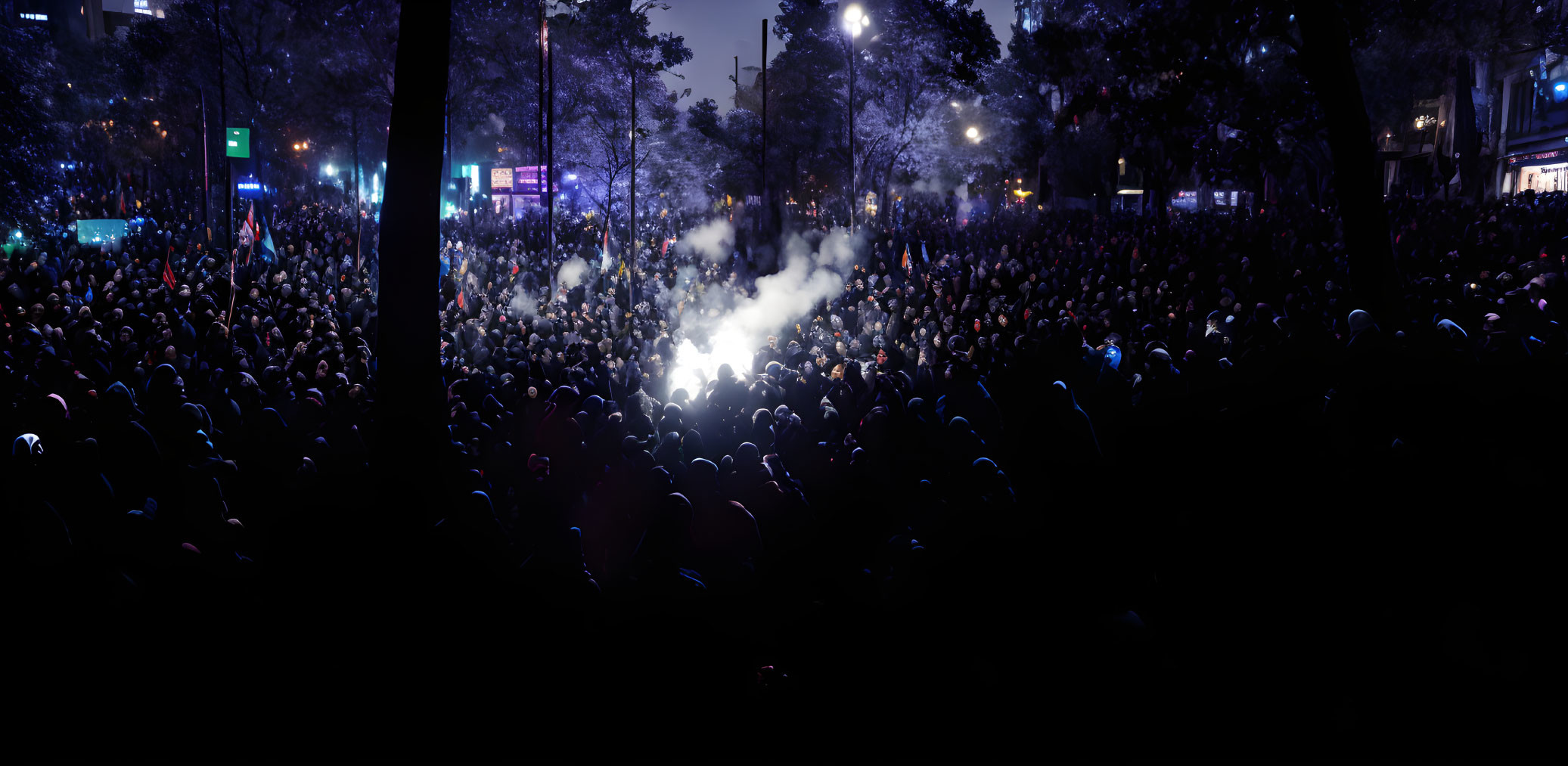 Crowd at Night Event Surrounded by Lights and Trees