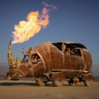 Mechanical armadillo creature emits fire in desert