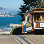 Vintage cable car near Golden Gate Bridge on serene coastline