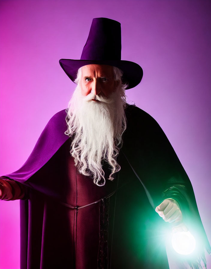 Wizard costume with white beard and glowing orb on pink backdrop