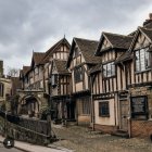 Medieval European street with half-timbered houses and cobblestone paths