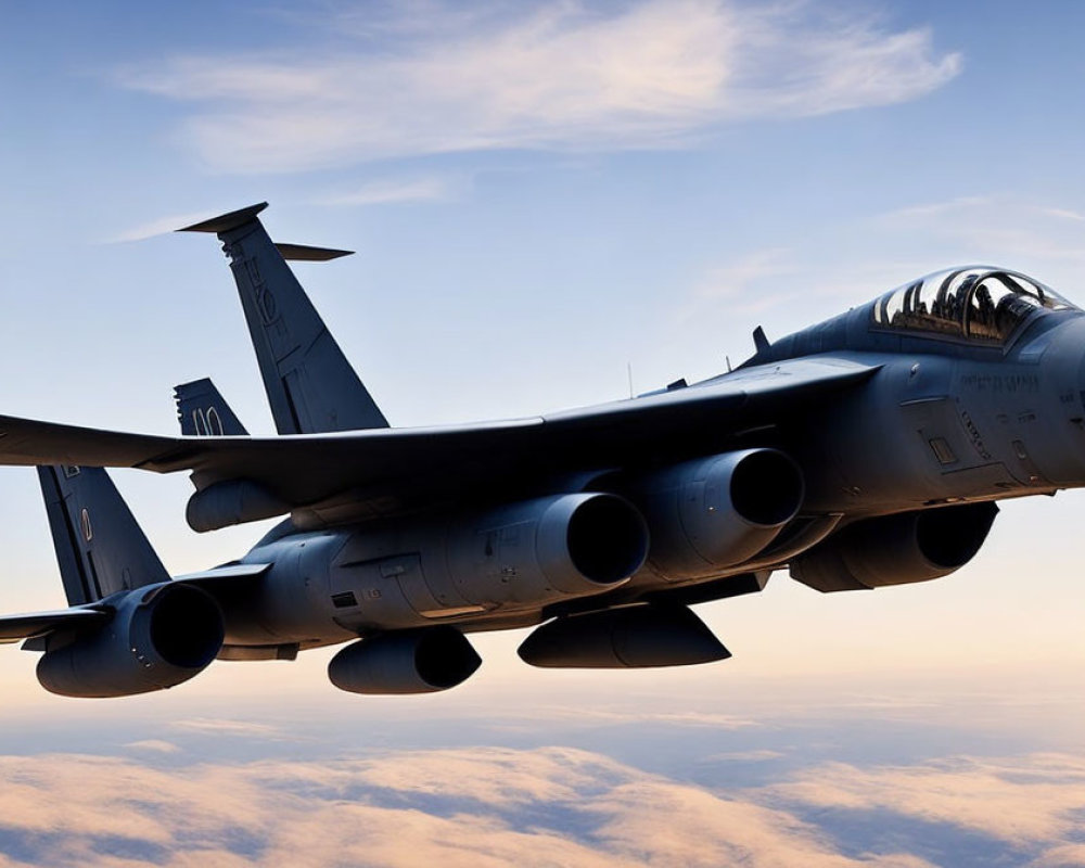 Military fighter jet with multiple engines soaring above clouds at sunrise/sunset.