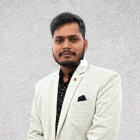 Blue-haired man with cybernetic details in white jacket on grey backdrop