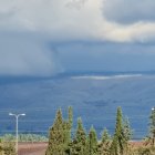 Panoramic View of Glacier, Stormy Sky, Greenery, and Sea