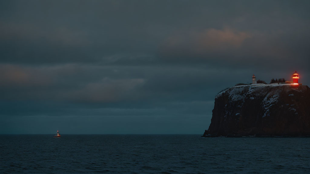 Dusk scene: dark sea, lighthouse, buoy light, cloudy sky