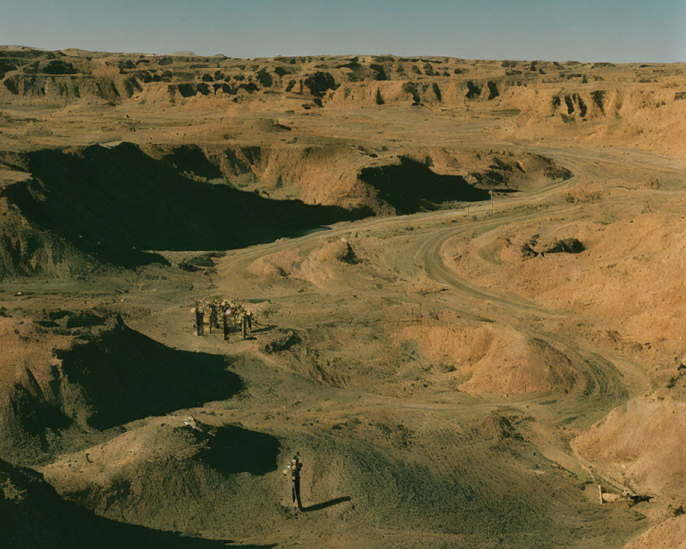 Barren desert landscape with isolated industrial structure