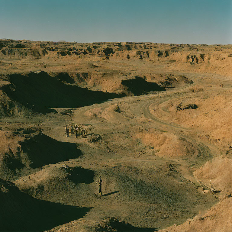 Barren desert landscape with isolated industrial structure