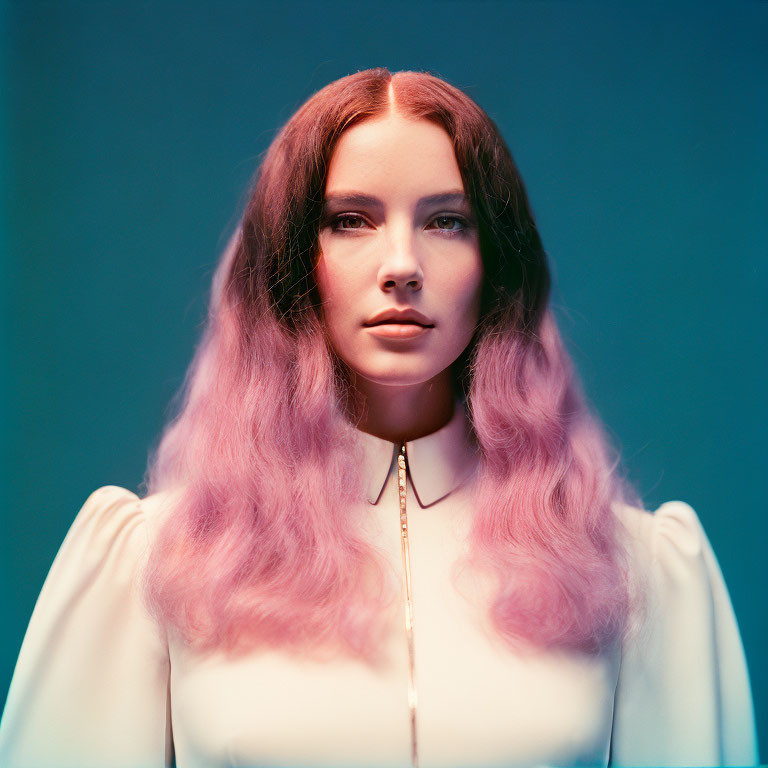 Woman with Pink Ombre Hair in White Top on Blue Background