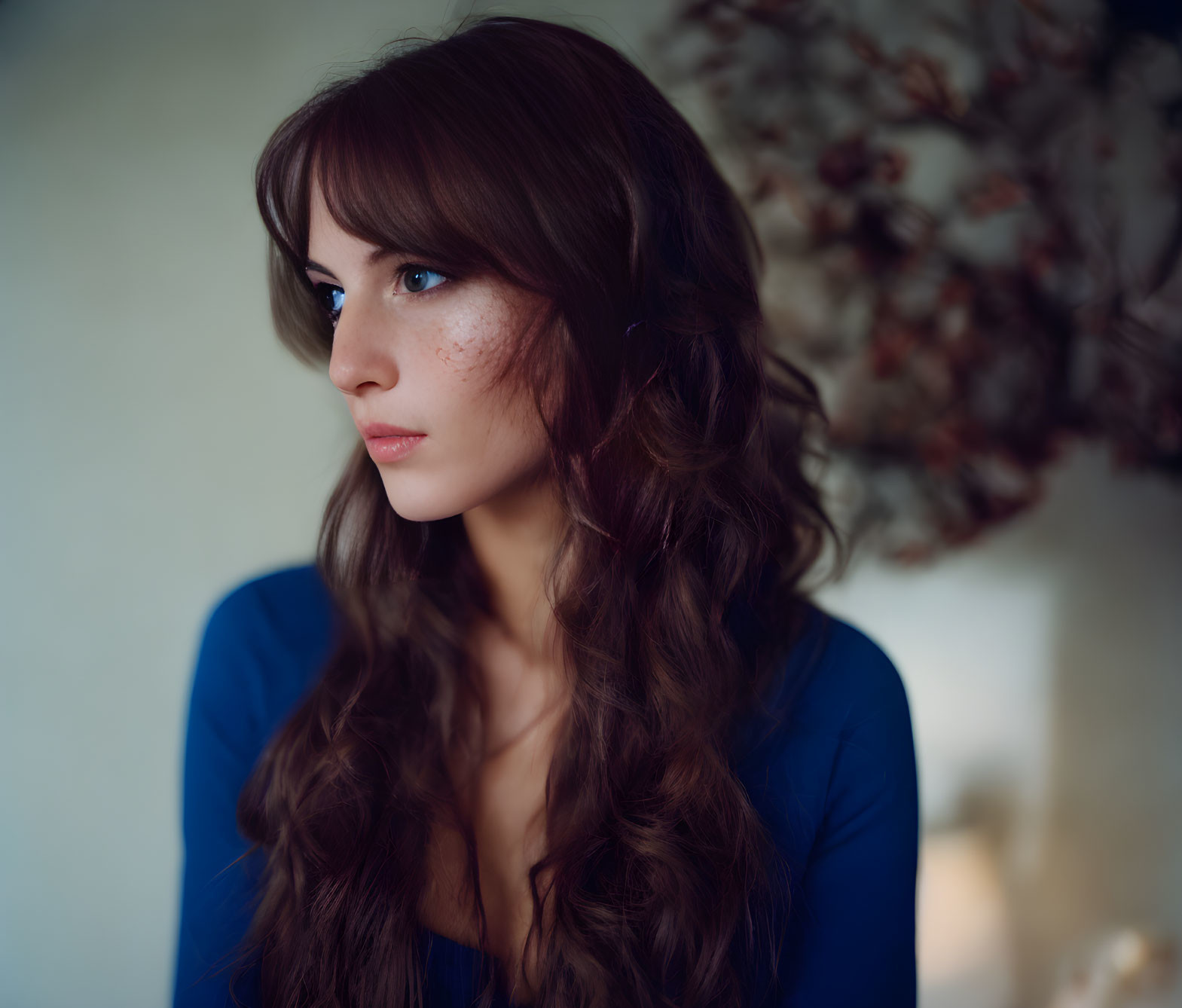 Long Wavy Hair Woman with Freckles in Blue Top