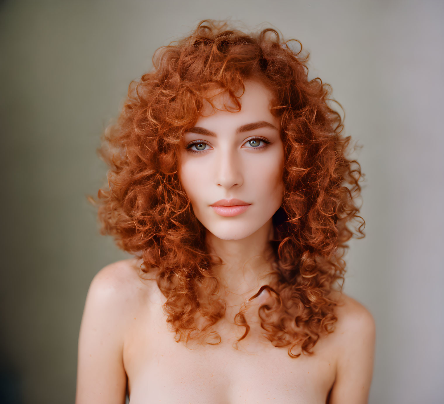 Portrait of Person with Voluminous Curly Red Hair and Blue Eyes