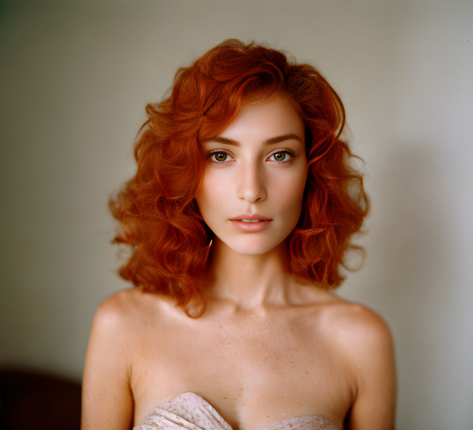 Curly Red-Haired Woman with Freckles in Serene Pose