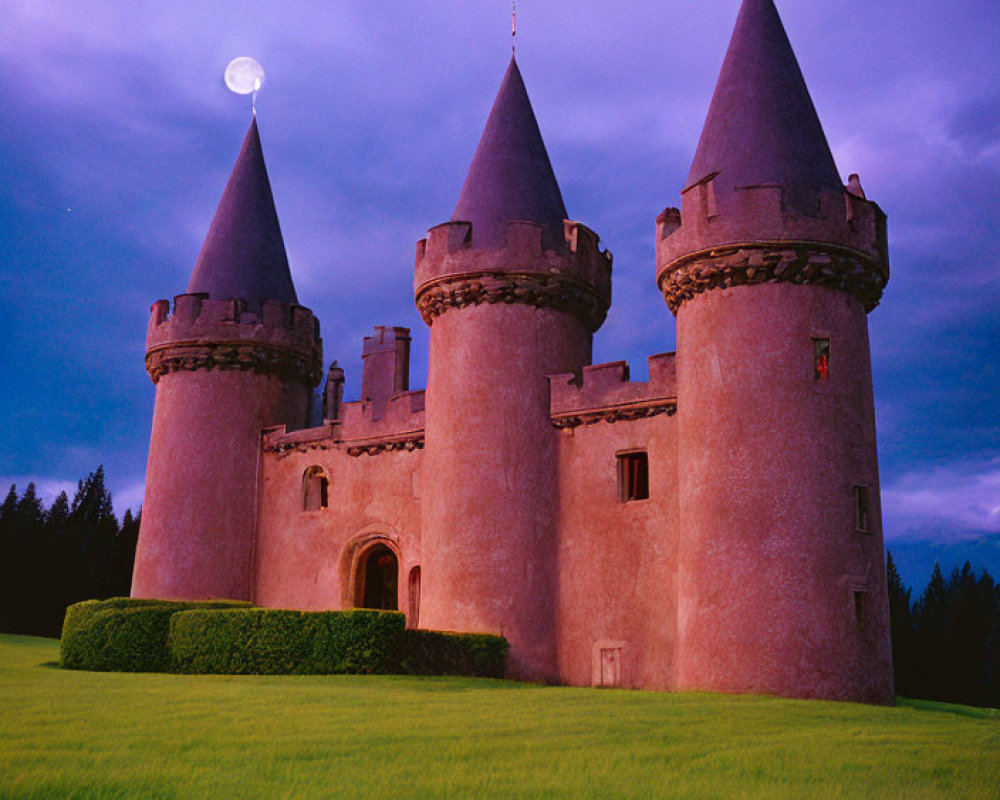 Pink-toned castle with conical towers under full moon