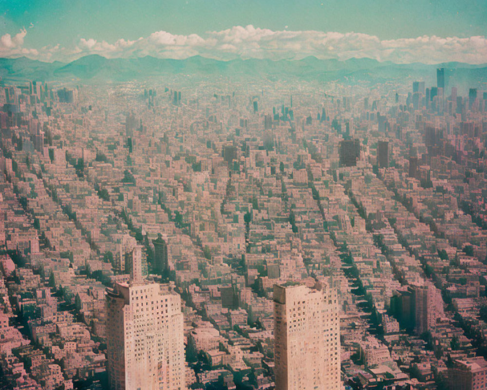 Densely Packed Cityscape Under Cloudy Sky