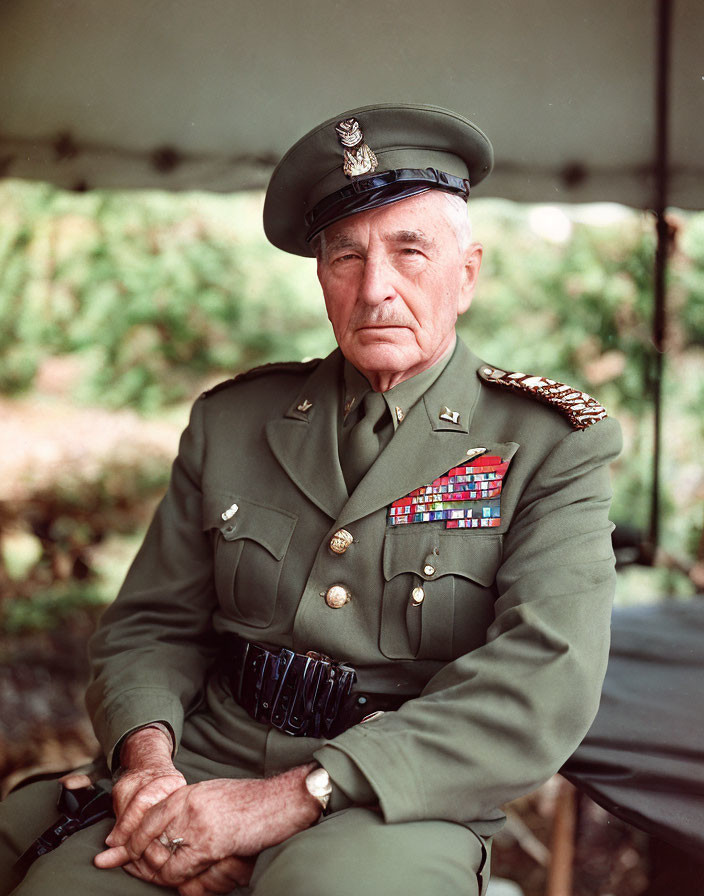 Elderly military officer in dress uniform with medals under a tent