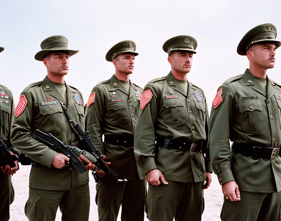 Military personnel in uniform with rifles and American flags.