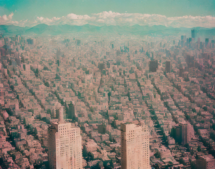 Densely Packed Cityscape Under Cloudy Sky