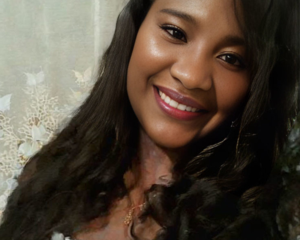 Smiling woman with long dark hair and necklace on floral background