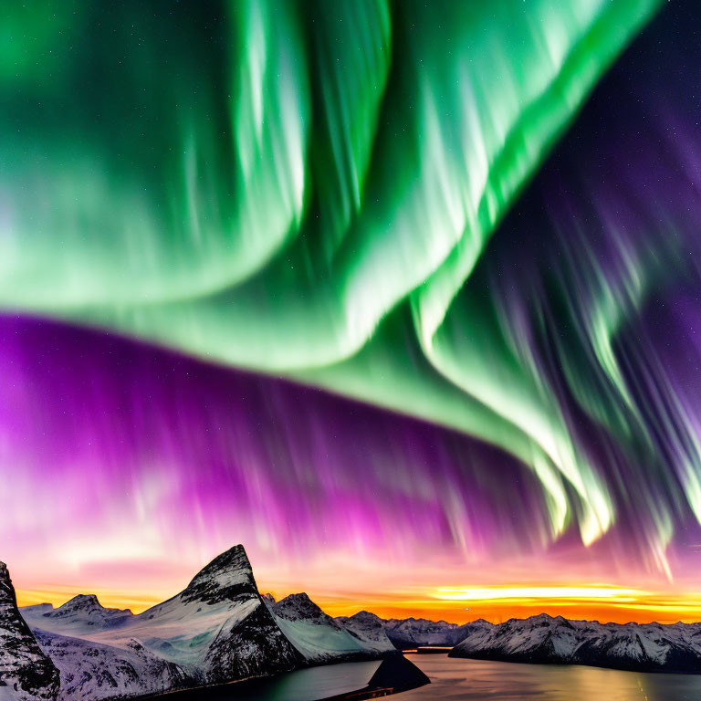 Colorful Aurora Borealis Over Snow-Capped Mountains at Twilight