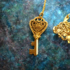 Golden key with heart-shaped designs on cosmic background symbolizing love and mystery.