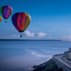 Hot Air Balloons Over Misty Mountains and Castle Landscape