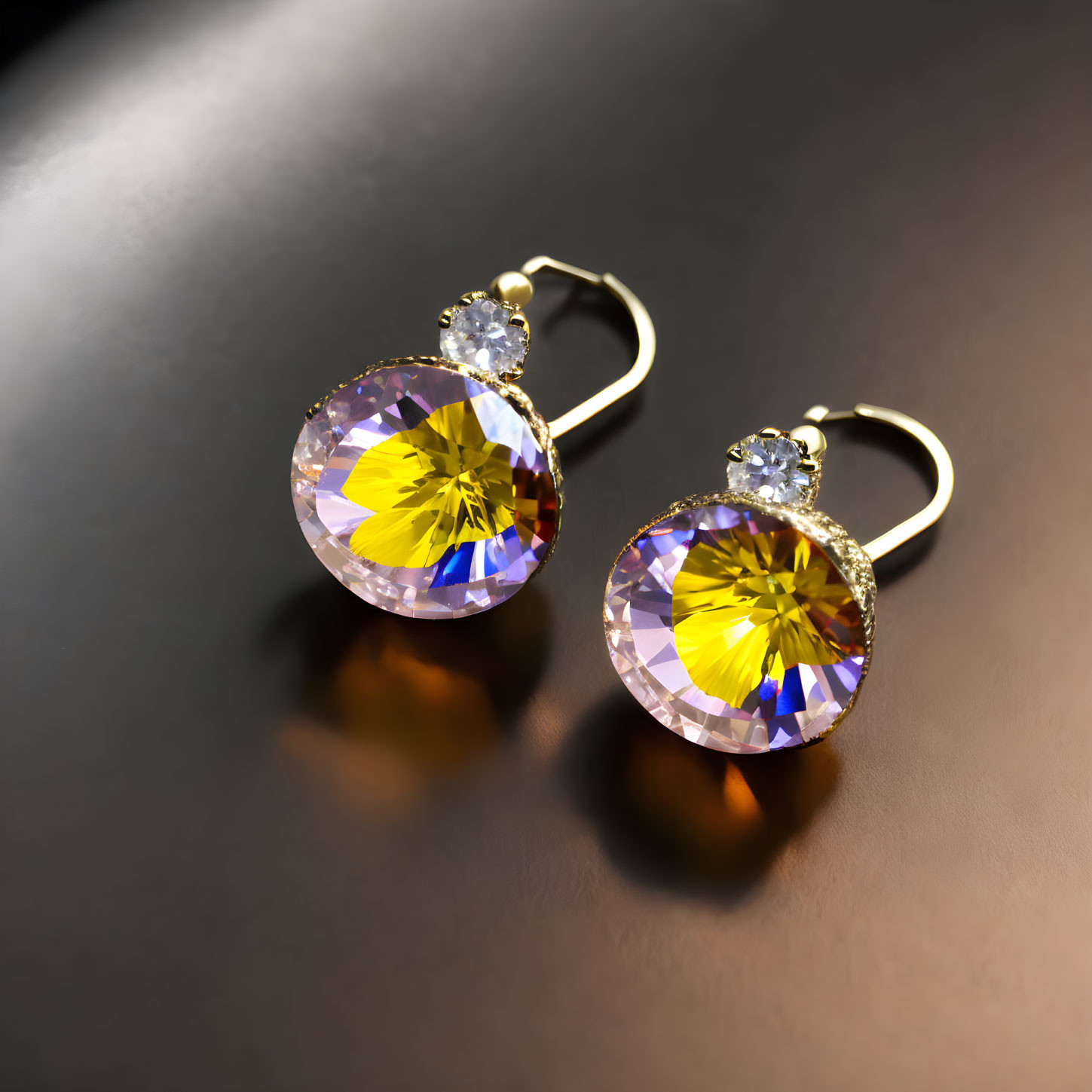 Yellow Gemstone Earrings with Clear Crystals on Reflective Surface