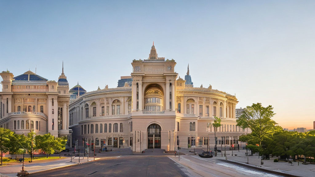 Neoclassical building with central tower and large windows at dawn/dusk