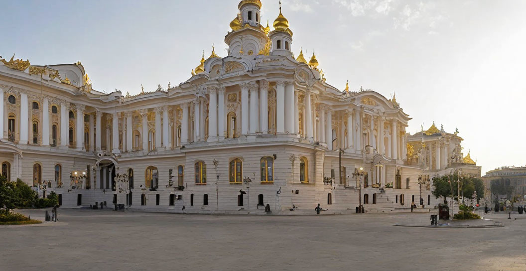 Majestic white building with golden domes in sunny square