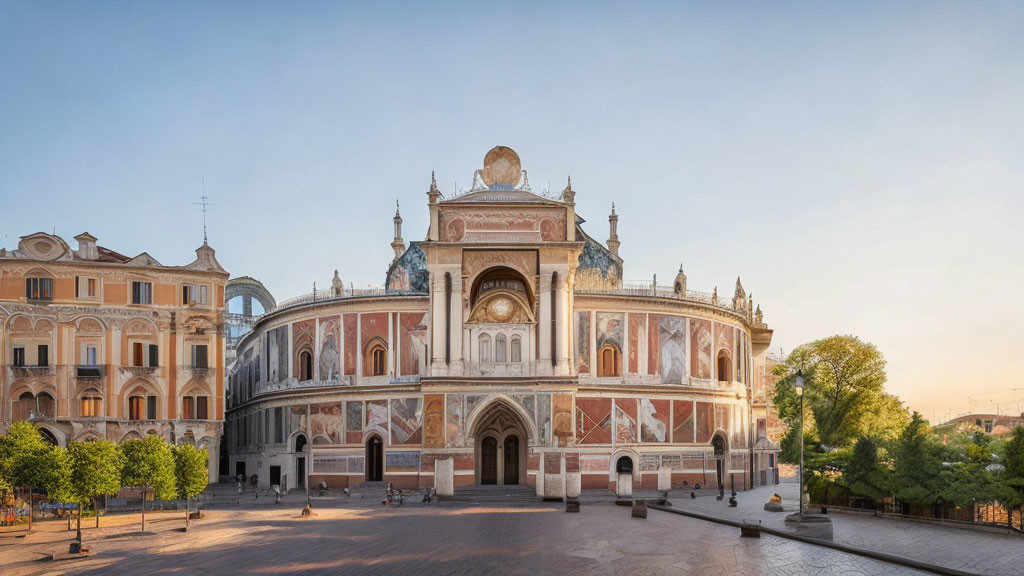 Ornate facade of grand building with arches and frescoes in soft sunlight