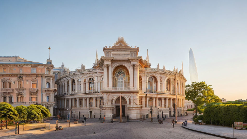 Historical building with intricate architecture at sunset in a spacious square