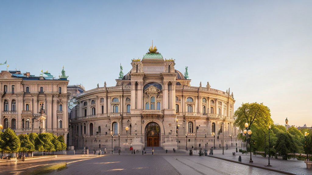 Neoclassical building adorned with sculptures at sunset