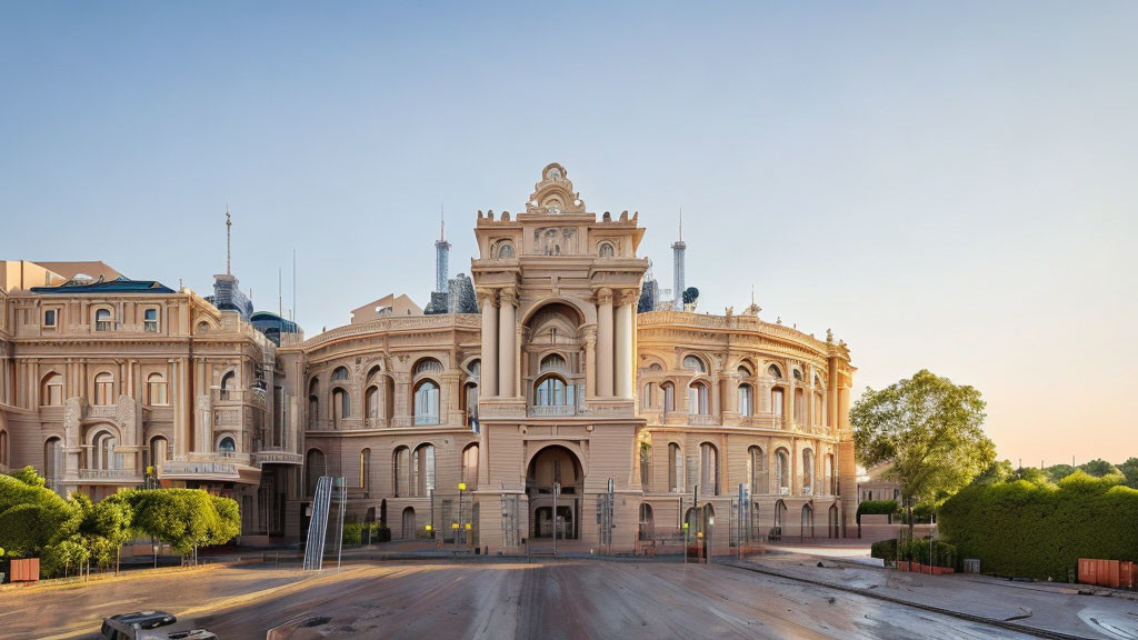 Beige classical building with balconies and arched windows