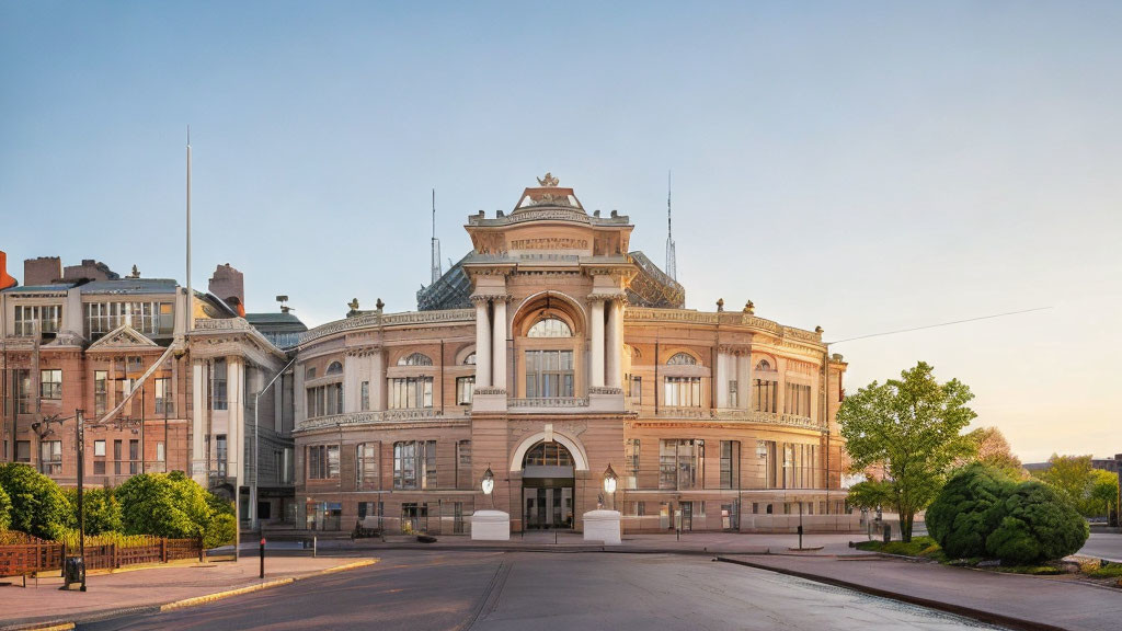 Classical building with grand entrance, intricate facade, and dome on quiet street