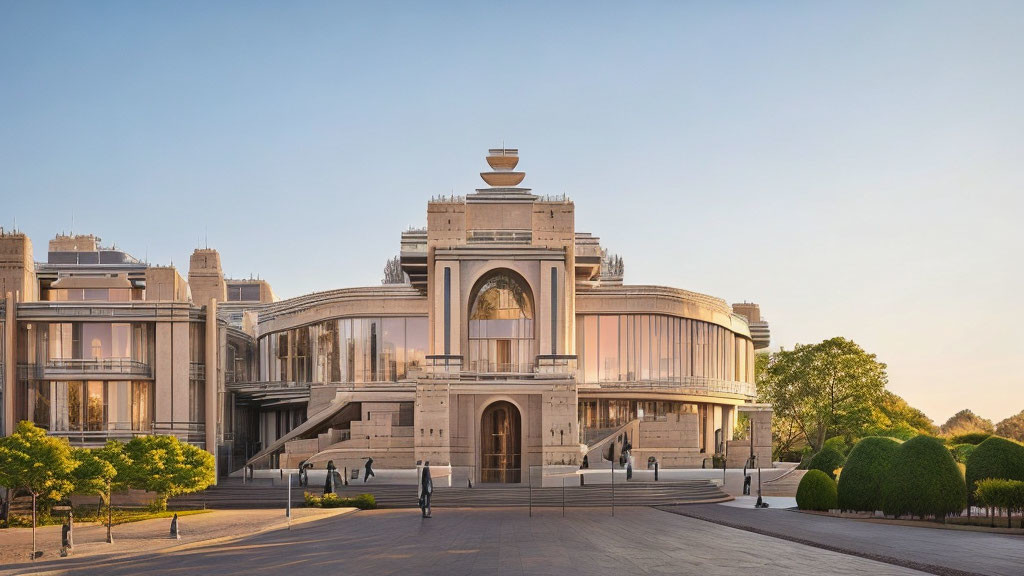 Neoclassical building with columns, staircase, and gardens under clear sky