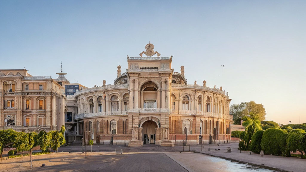 Neoclassical building with elaborate façades and sculptures at dawn or dusk