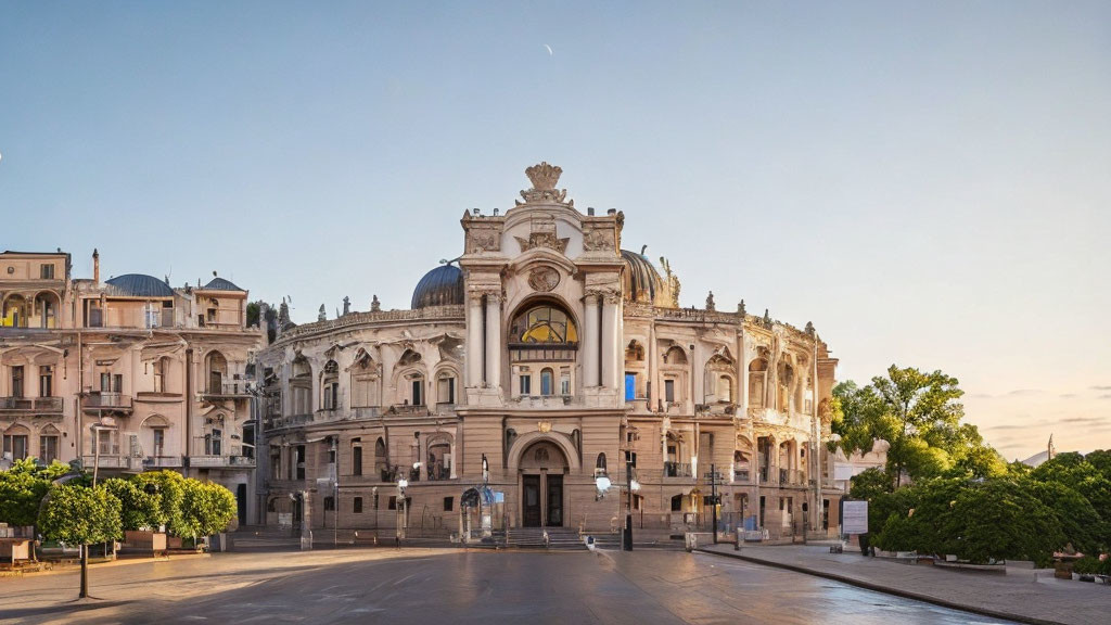 Historic building with elaborate architecture and statues under blue sky