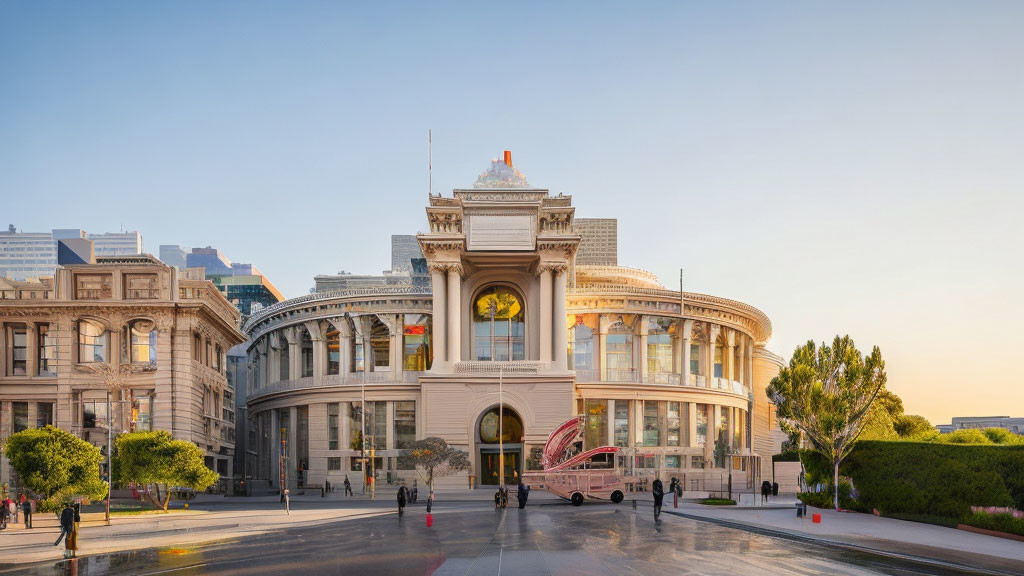 Circular glass facade on grand neoclassical building at sunset