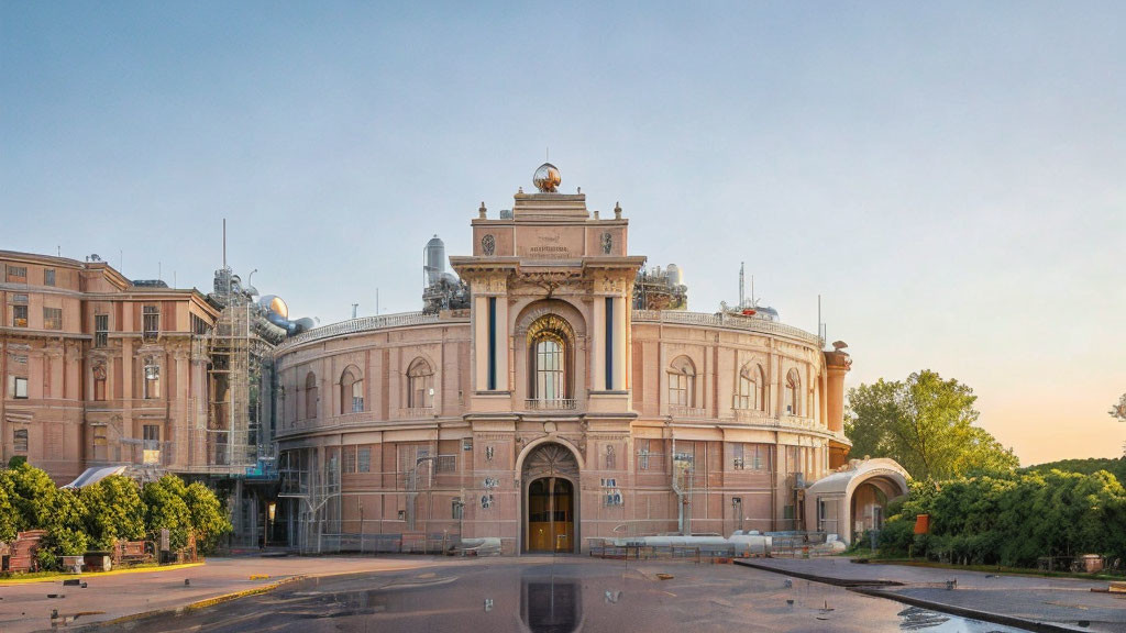 Historic building with arched entrance and domed roof at dawn or dusk