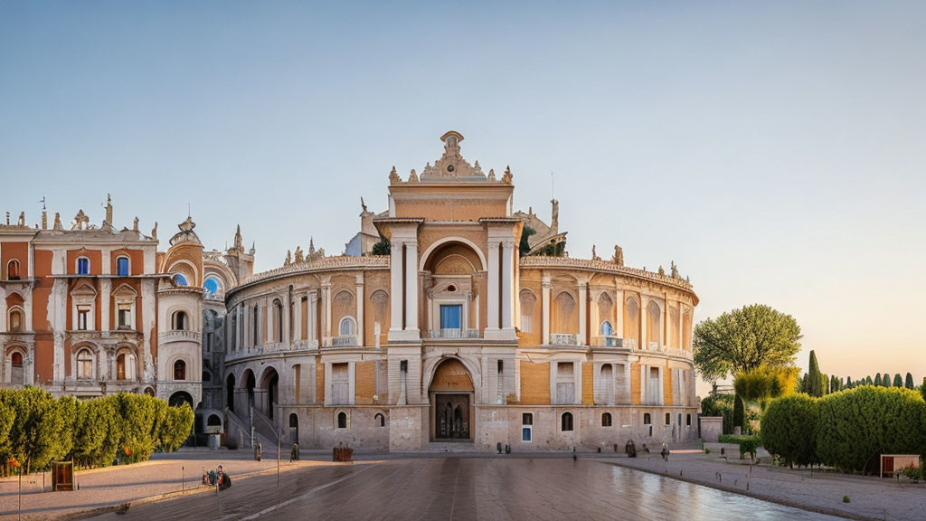 Neo-Renaissance building with visitors and tree-lined plaza