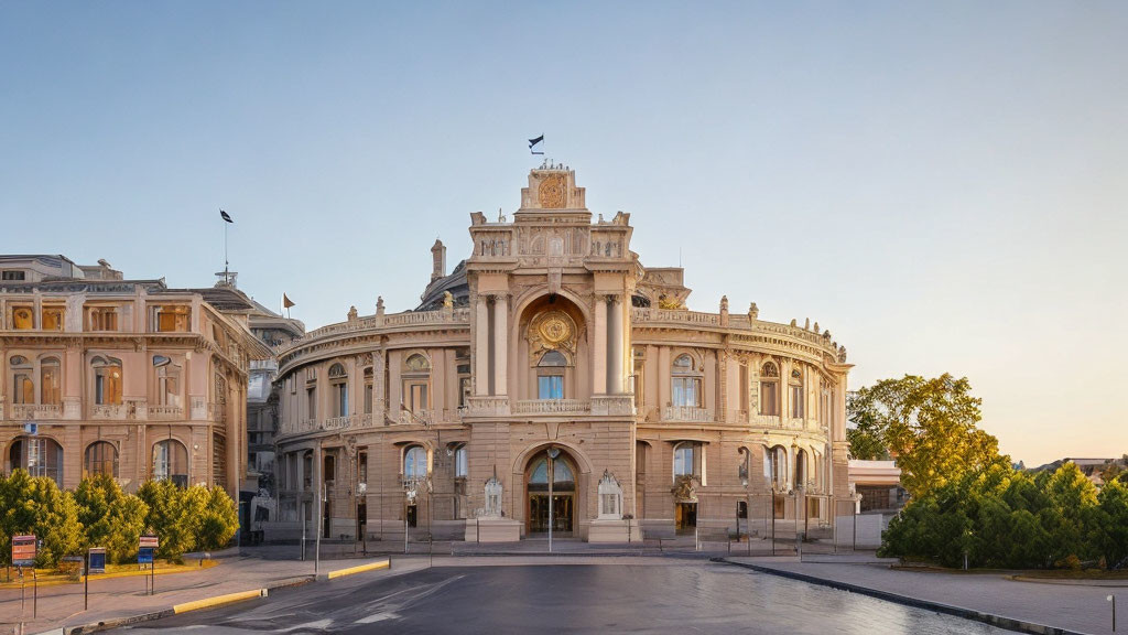 Neoclassical Building with Clock, Flags, and Clear Sky at Dawn or Dusk