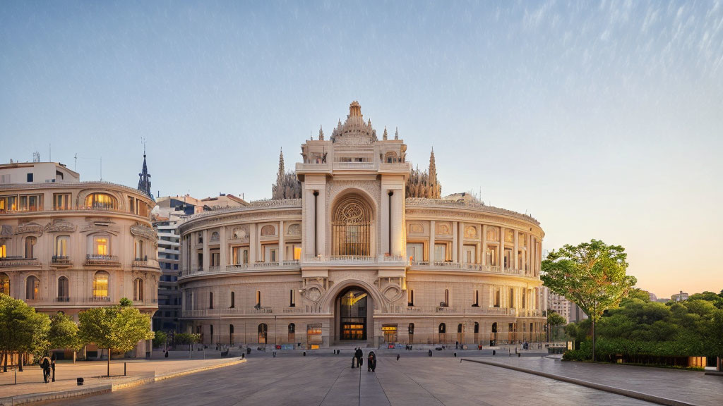 Neoclassical building with arched entrances and sculptures at dusk