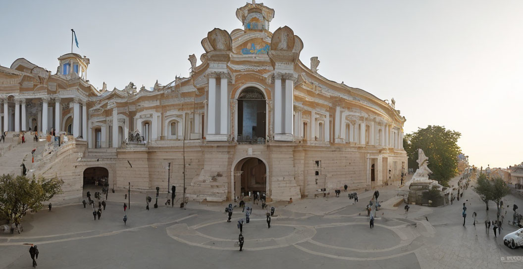 Elegant neoclassical building with visitors on steps at sunset