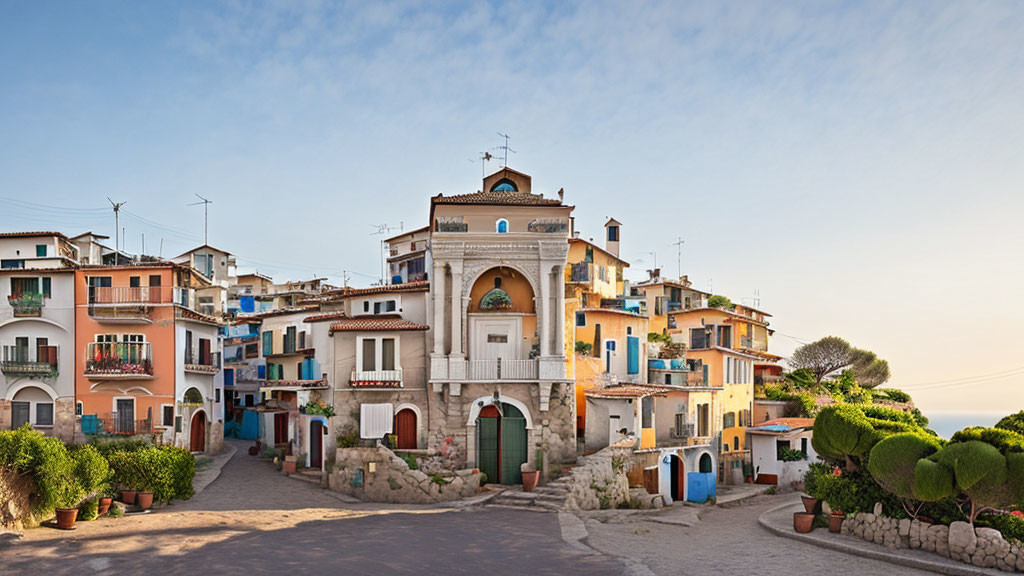 Historic town square with colorful houses and greenery under blue sky