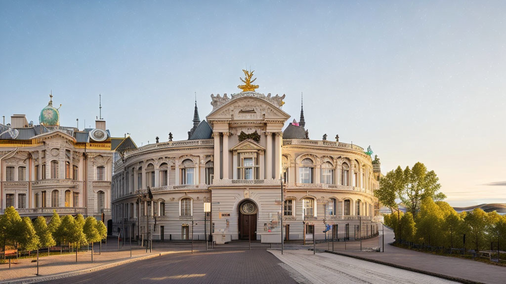 Classical building with golden crest pediment and towers at dusk