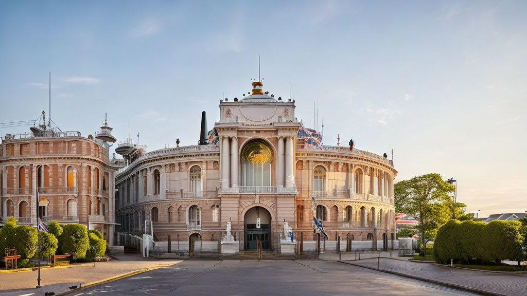 Neoclassical architecture building with central archway and dome at dawn or dusk