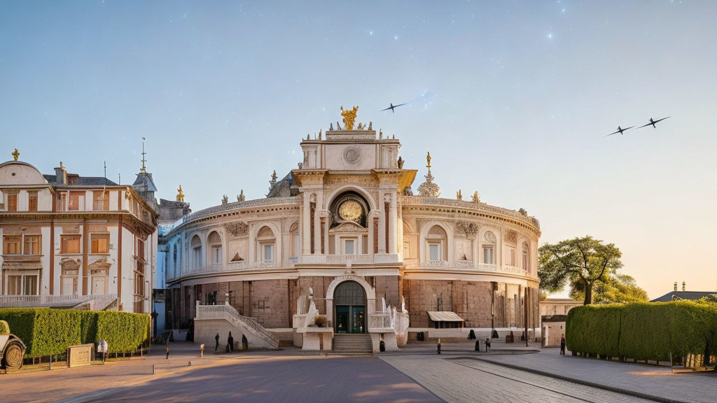 Ornate classical building with clock tower and sculptures under clear sky