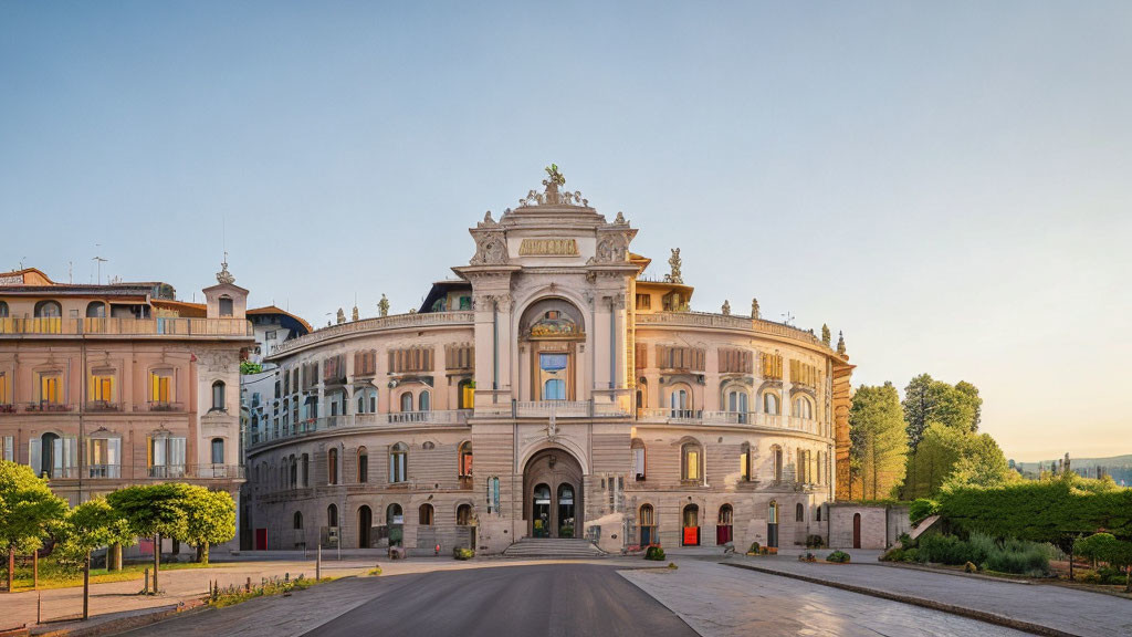 Historic building with ornate facade, archway entrance, statues, and modern surroundings