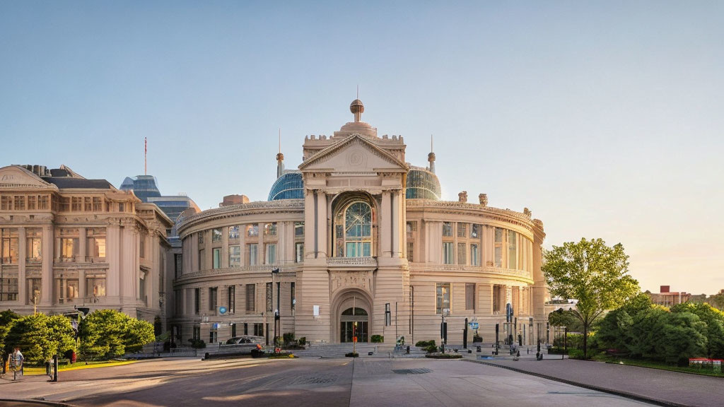 Neoclassical building with central dome and archway in soft sunlight